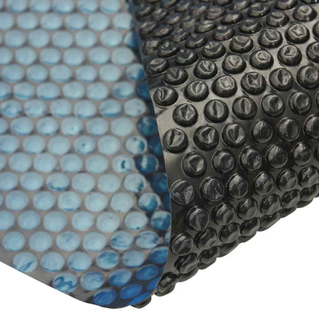 Vidaxl zwembadfolie solar drijvend 600x300 cm pe zwart en blauw